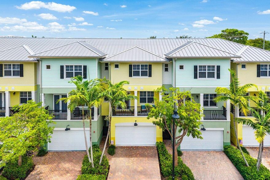 Perfectly positioned in East Delray Beach, this beautifully updated 4 bed, 3.5 bath townhome offers the ideal blend of space, convenience, and coastal living just minutes from the beach, Atlantic Avenue, and Mizner Park. Featuring one of the largest floor plans in the community, this three-story residence is one of only two homes with a private elevator. Upgrades include a renovated primary bath, 10-foot ceilings, hurricane-impact windows and doors, multiple private balconies, custom California Closets, and built-in storage throughout. The versatile layout offers a first-floor guest suite and opens to a private gated patio and garden with a mango tree. Complete with a 2-car garage, private driveway, clubhouse, pool, basketball court, putting green, and playground.