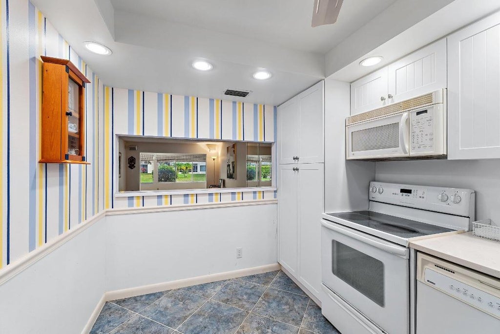 Photo of 3186 Via Poinciana #111, Lake Worth, FL 33467 (MLS # R11152048)