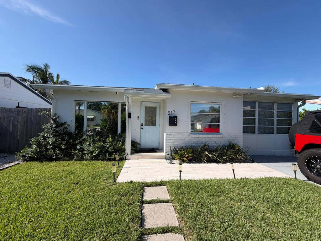 Photo of 217 E 24TH Street, Riviera Beach, FL 33404 (MLS # B26063718)