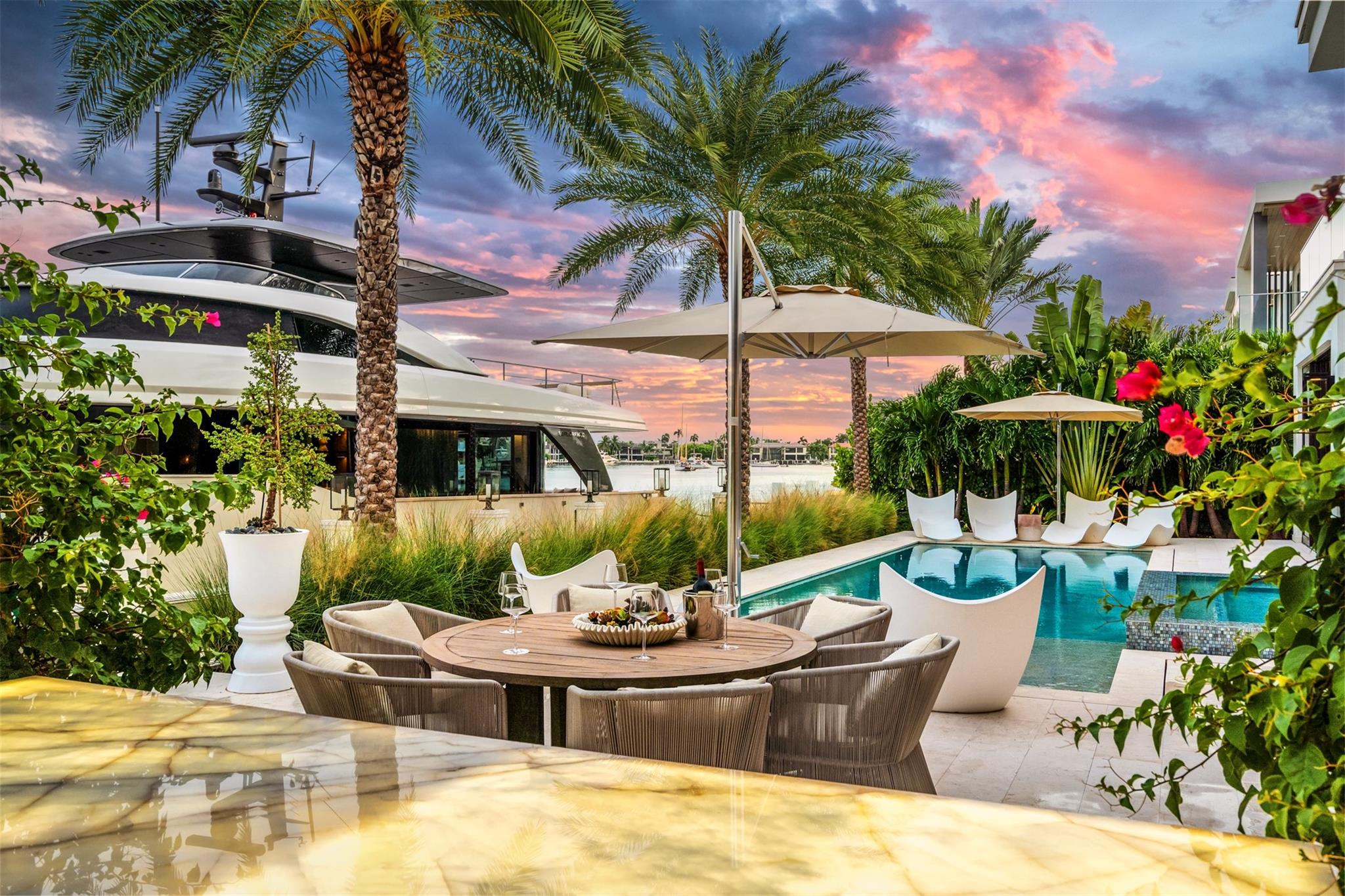 TIMELESS WATERFRONT MASTERPIECE IN EXCLUSIVE HARBOR BEACH! A RARE OFFERING IN FT. LAUDERDALE'S MOST PRESTIGIOUS PRIVATE BEACH CLUB COMMUNITY, THIS BREATHTAKING ESTATE EMBODIES ELEGANCE, SOPHISTICATION, & EFFORTLESS COASTAL LUXURY! EVERY ELEMENT FEATURES THE FINEST IN CRAFTSMANSHIP! WITH A 100' MARBLE CLAD DOCK ALONG THE WIDE INTRACOASTAL CANAL, PANORAMIC VIEWS OF SERENE LAKE SYLVIA, & JUST MINUTES TO THE OCEAN, THIS IS THE ULTIMATE IN SO. FLORIDA LIFESTYLE! EXTRAORDINARY FLOOR PLAN FILLS TODAY'S LUXURIOUS LIVING PRIORITIES W/ HIGHLY FUNCTIONAL & OPEN ENTERTAINING AREAS SET AROUND THE MODERN CHEFS KITCHEN, CHAMPAGNE BAR, VAST BACK PATIO, & RESORT-STYLE POOL & SPA!! FULL GYM, SUMMER KITCHEN, NUMEROUS BALCONIES, UP T0 6 CAR GARAGE, GENERATOR & SECURITY GUARDS MAKE THIS THE PERFECT DREAM HOME!