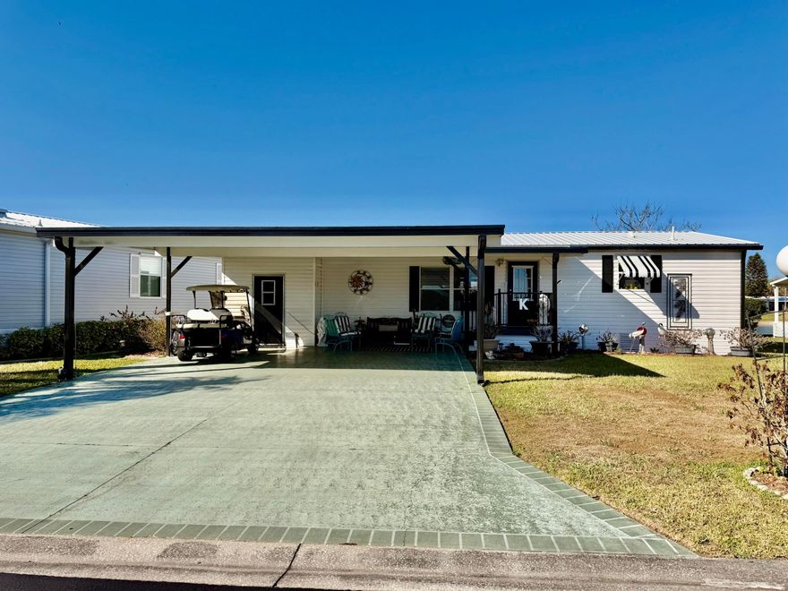 SEMINOLE COVE~ Delightful waterfront 2 Bd/ 2 Ba DWMH with double carport and covered patio. Step into this sweet home with an open floor plan and majestic view of the community lake. The lovely light aqua kitchen has a pantry and bkfast bar.  This home offers Floridian elegance. The split plan and mirrored doors in the great room add to its charm.  Relax on the back deck and let the lake breeze remind you of why you moved to Florida. Gated community, heated pool and fun activities await you!  The PERFECT SEASONAL Home! 
Dimensions are approximate, must measure for exact