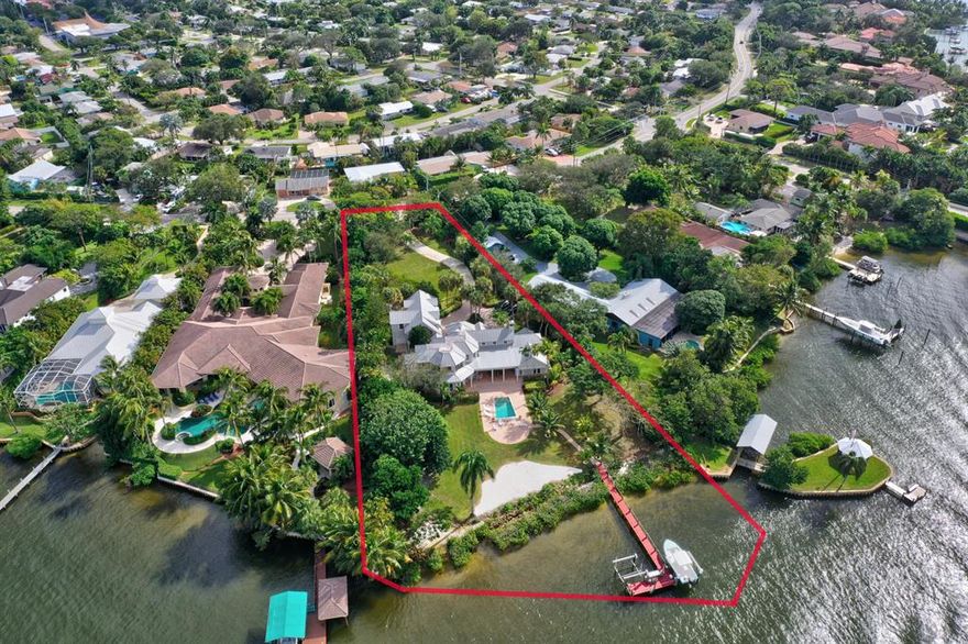 Extremely rare privately gated, 5 bedroom, 4.5 bth, 3.5 car garage, pool home nestled on 1.27 acres, boasts 181 ft. frontage on the North Fork, of the Scenic and Wild Loxahatchee River. Built in 2000 by D&D Costanakos, this estate offers 3 bedrooms in the main house and 2 additional bedrooms in the guest house, located over the garage. The desirable  pie shaped lot widens to take full advantage of the 181ft river frontage.  The Tequesta Drive bridge has 15ft clearance at high tide, facilitating quick access to the River and Jupiter Inlet. Close to shopping, golf clubs, tennis facilities, restaurants, outstanding medical care and a long list of amenities provided by the  the Jupiter/Tequesta lifestyle. Additional conveniences include close proximity to airports, I95 and the Florida Turnpike