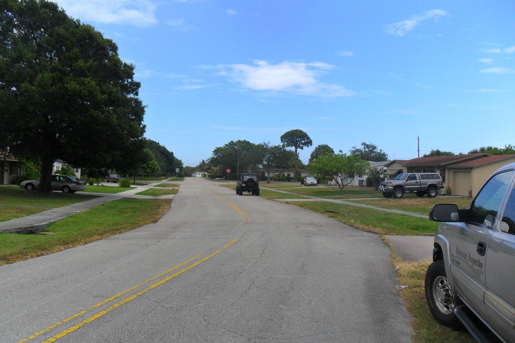 Photo of 730 W ILEX Drive, Lake Park, FL 33403 (MLS # B26080946)