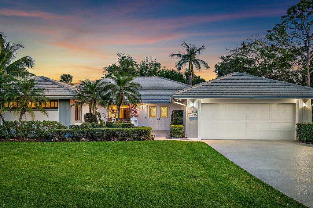 GORGEOUS three-bedroom, two and half bathroom home situated in a quiet cul-de sac on an oversized lot in one of the Treasure Coast's most desired country club communities -- Piper's Landing Yacht and Golf Country Club. This charming single-story, single-family home is in IMMACULATE condition and boasts wide open living spaces with over 2,600 square feet of living space, vaulted ceilings, a large screened-in patio, and gorgeous garden views. New AC from 2020. 4549 SW Fenwick Lane will sweep you off your feet from the moment you lay eyes on the front exterior with a HUGE well-manicured front lawn, lush tropical landscaping, and extra-long driveway. Enter the front doors to be impressed by its light and bright, airy feel with abundant natural light and Oak flooring