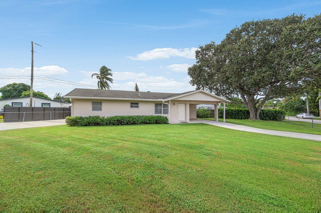 Photo of 2766 NEW YORK Street, West Palm Beach, FL 33406 (MLS # B26090432)