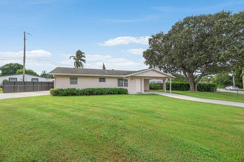 Photo of 2766 NEW YORK Street, West Palm Beach, FL 33406 (MLS # B26090432)