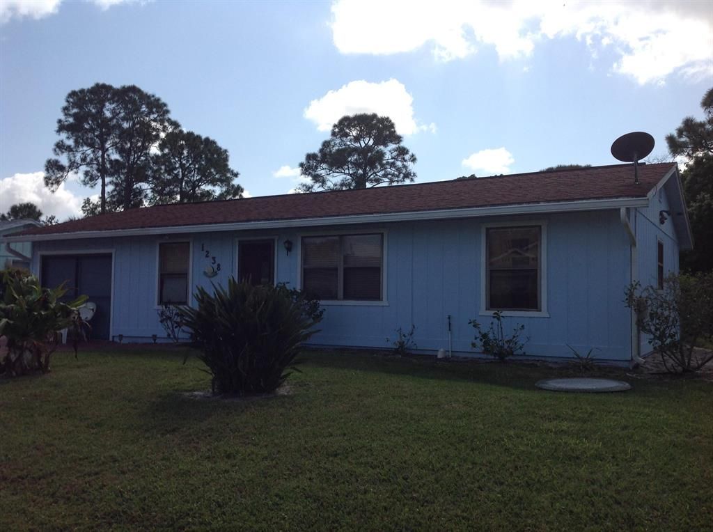 Photo of 1238 SW Fountain Avenue, Port Saint Lucie, FL 34953 (MLS # R10777914)