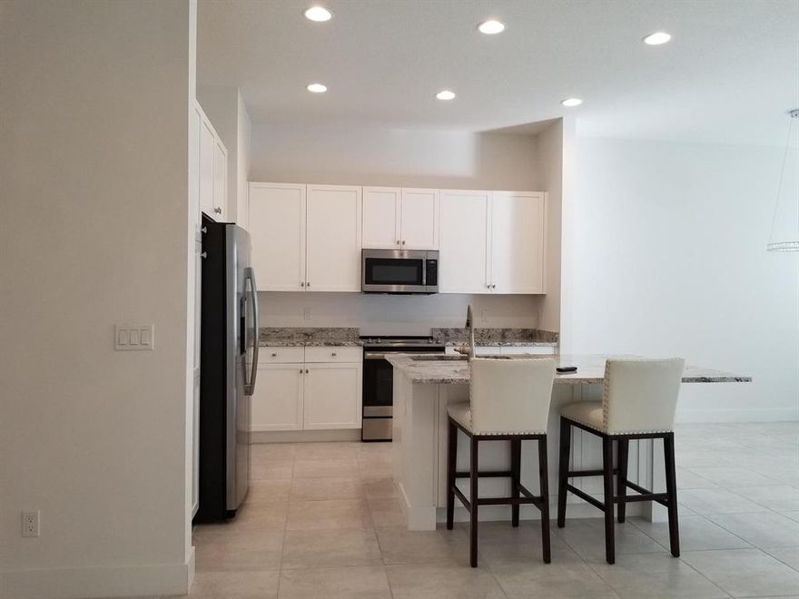 Your opportunity has arrived.  This 3 bedroom 2.5 Bath home with 2 car gar a very nice grass backyard for grilling etc. and most of all ALMOST NEW TOWNHOME WITH THE ABILITY TO WALK TO EVERYTHING.  RESTAURANTS, GROCERY, SHOPS ETC.  An opportunity doesn't come around like this very often.  The kitchen with stainless steel appliances, granite and beautiful cabinetry overlooking the great room with HURRICANE IMPACT SLIDERS out to your lovely patio.  All bedrooms are upstairs with master bedroom and private bath along with two other bedrooms and full bath. Laundry room on second level for your added convenience. There is a half bath on the main level too. Call to book your appointment now before this one is gone. ALL WINDOWS, DOORS, SLIDERS ARE ALL HURRICANE IMPACT. This community offers a pool