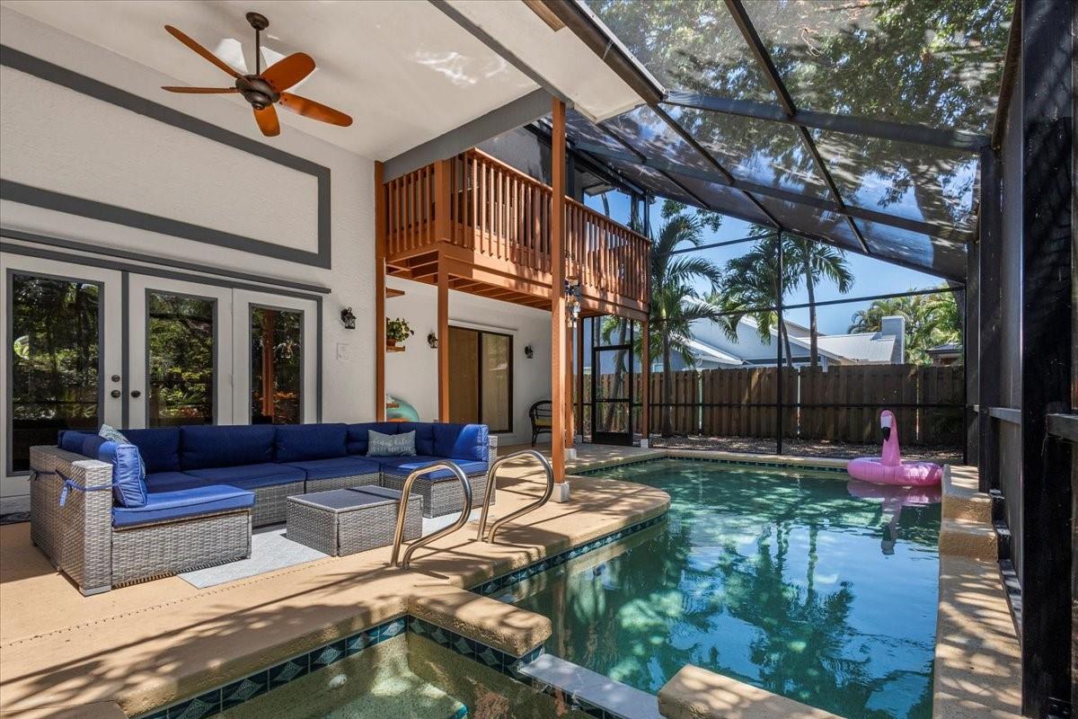 You’ll love coming home to this fully furnished hidden gem on Sailfish Sands Golf Course. Step into the soaring entry way with a flex room perfect for a home office or game room. The cozy living room with coral fireplace opens to a spacious kitchen and casual dining area, flowing effortlessly to the screened heated pool and spa. The downstairs bedroom suite offers private access to the lanai, your own backyard escape. Upstairs, a large landing leads to a media room, split floor plan, and a serene primary suite with a screened balcony overlooking the pool. Beautifully landscaped and perfectly located near beaches, shopping, and downtown Stuart. No HOA—bring your boat, RV, or golf cart! Pool maintenance included in monthly rent.