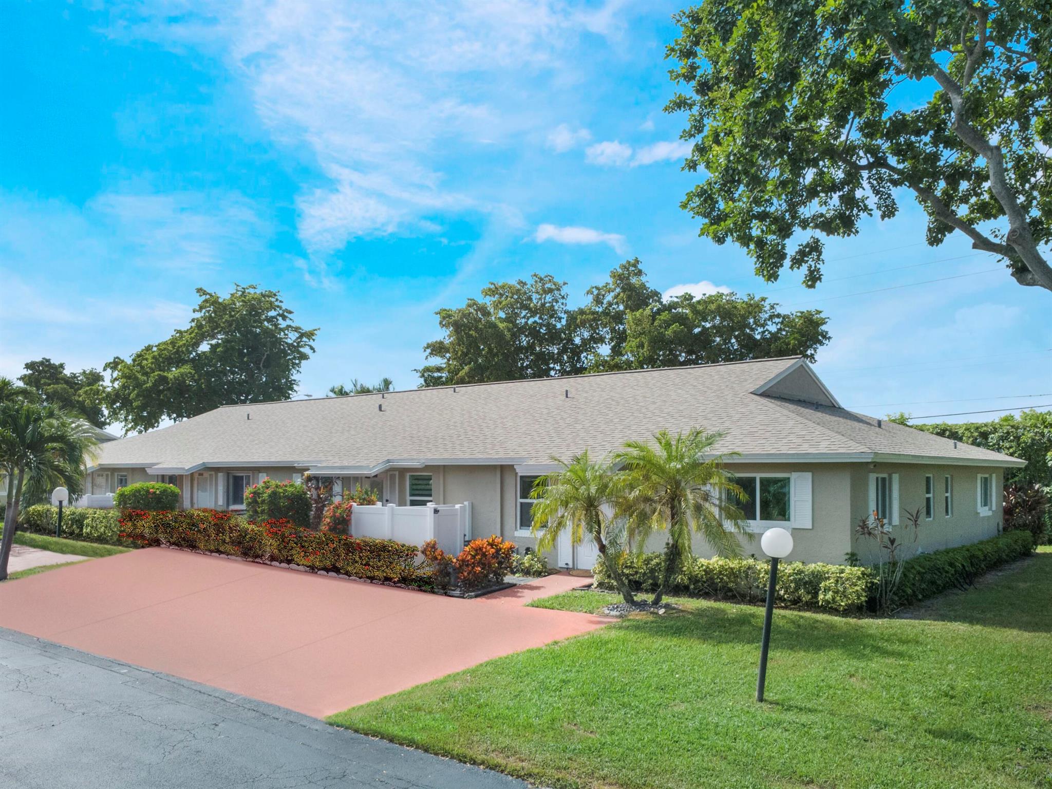Welcome to Whisper Walk, one of Boca Raton's most sought after 55+ gated communities! This beautifully updated villa is located in the desirable Greenleaf section, surrounded by lush landscaping, scenic acres, and picturesque lakes.Step inside and be impressed by the thoughtful updates throughout. The home showcases luxury vinyl plank flooring, custom blinds on every window, and IMPACT windows & doors for security and peace of mind. A brand NEW ROOF (2023), fresh interior paint, new LED lighting, and stylish ceiling fans make this villa truly move in ready. The stunning kitchen boasts stainless steel appliances and a full size washer and dryer add everyday convenience. With plenty of storage and tasteful finishes, every detail has been designed for comfort.