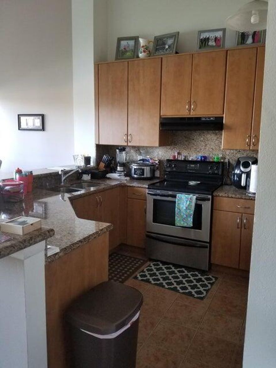 Great looking 2/2 New Flooring downstairs being installed. Features granite countertops and nice kitchen cabinets, stainless steel appliances, ceramic tile, carpet in living areas. 14' ceilings, patio with lake view. Updated Bath and nice view of the lake.  Easy move in with  First Month rent and Security Deposit only needed.  Must have at least 620 Credit score. Two parking spaces. Pets allowed. Available April 1st.