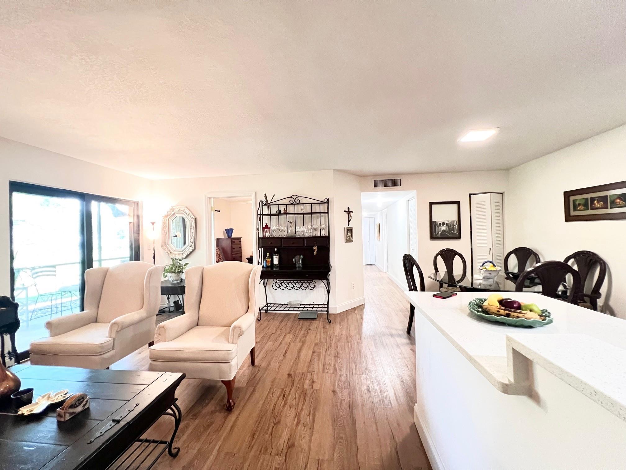 Gated 55+ community. First Floor Azalea Model with a water View! Unit has been updated with Impact windows, kichen cabinets, countertops and flooring. Bonus room to use as a 3rd bedroom or office. Kings Points has many clubs, courtesy buses and a beautiful theater.