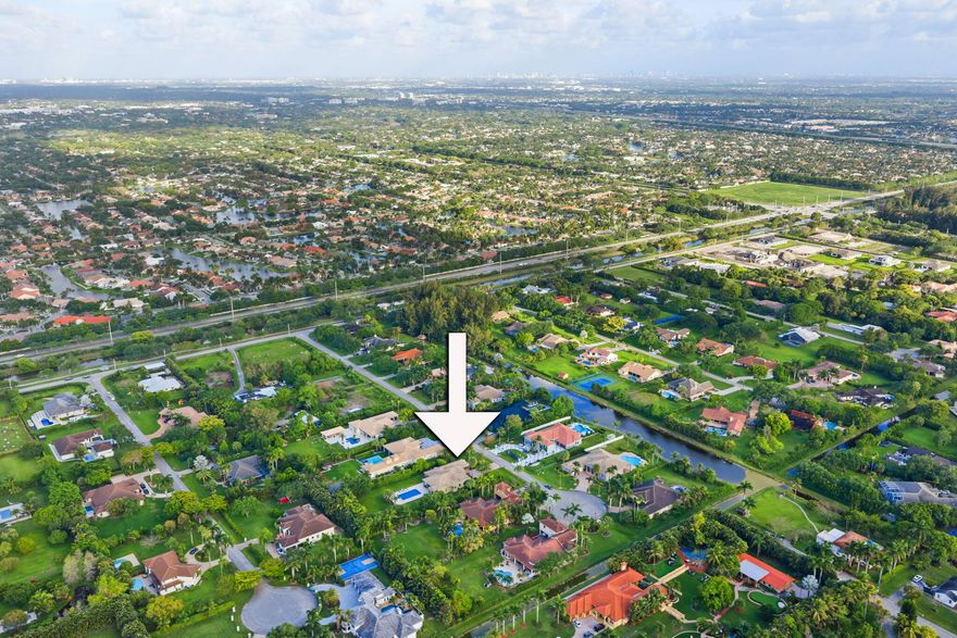 SITUATED ON A SPRAWLING ACRE LOT IN A QUIET CUL-DE-SAC IN SOUGHT-AFTER PLANTATION ACRES, THIS METICULOUSLY MAINTAINED 5-BEDROOM + 2 OFFICES (CAN BE USED AS BEDROOMS), 3.5-BATH HOME OFFERS SPACE, PRIVACY, AND TRUE SOUTH FLORIDA LIVING. FEATURING A 3-CAR GARAGE, THE HOME WELCOMES YOU WITH LUSH LANDSCAPING, CHARMING CURB APPEAL, AND A BRIGHT OPEN LAYOUT WITH SOARING 12' CEILINGS, MARBLE FLOORS, AND ABUNDANT NATURAL LIGHT. STEP OUTSIDE TO YOUR PRIVATE OASIS WITH AN AMAZING RESORT-STYLE POOL, OVERSIZED JACUZZI, EXPANSIVE DECK, AND COVERED LANAI—PERFECT FOR ENTERTAINING OR RELAXING IN TOTAL PRIVACY. LARGE, FULLY FENCED YARD WITH ENDLESS POTENTIAL. IDEALLY LOCATED NEAR TOP SCHOOLS, HIGHWAYS, SHOPPING, DINING, AND BEACHES.