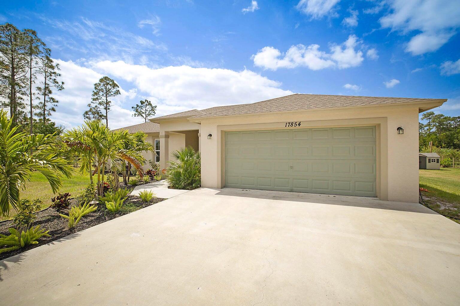This stunning modern home is the perfect blend of style, comfort, and savings! With owned solar panels slashing electric bills to just $35-$50/month, a free electric car charger, and exclusive financing perks through our preferred lender permanent buydown with free future refinancing offered, it's both smart and luxurious. Inside, enjoy sleek luxury flooring, a gourmet kitchen with granite countertops, stainless steel appliances, and reverse osmosis water filtration, plus Ethernet ports in every bedroom for seamless work or streaming. Hurricane impact windows provide safety and peace of mind, while beautifully landscaped grounds complete the picture. Move-in ready and built for modern livinga"schedule your showing today!