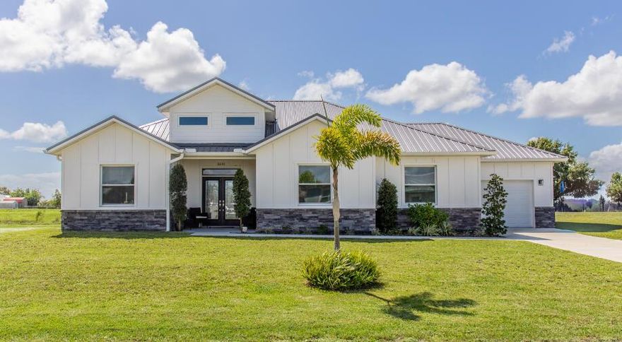 EDGEWATER ACRES ~ This 2024 CBS home on 1/2 an acre, features beautiful exterior stone detailing, a 1-car garage, & a spacious open concept layout. It boasts 1,790 sq ft of living space, & a total of 2,224 sq ft under air. This versatile home offers 4 rooms & 2 full bathrooms. You can enjoy a 3-bdrm layout w/ a dedicated dining room or a 4-bdrm configuration without a separate dining area. The kitchen features SS appliances, quartz countertops, & a large kitchen island w/ a built-in sink that doubles as a kitchen table, offering storage on both ends.The master bathroom is a true highlight, featuring a contemporary stand-alone tub, a large walk-in tiled shower, double vanity, & a walk-in closet. Throughout the main living area, you'll find elegant crown molding and chandeliers.