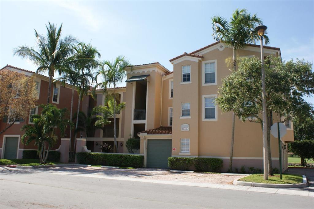 Don't miss this beautiful top floor unit in the heart of Wellington with electric, cable and internet included!!! Light and bright with expansive golf course views from every window and balcony. Two master size bedrooms with accompanying baths. Spacious living room with fireplace and crown molding plus a full size dining area. Enjoy a one car garage with additional private spot and development resort style pool, hot tub, tennis court, racquet ball, billiard room, full gym, security and on site management. PRIVATE GARAGE AND PARKING SPOT INCLUDED. INTERNET, CABLE and ELECTRIC INCLUDED
