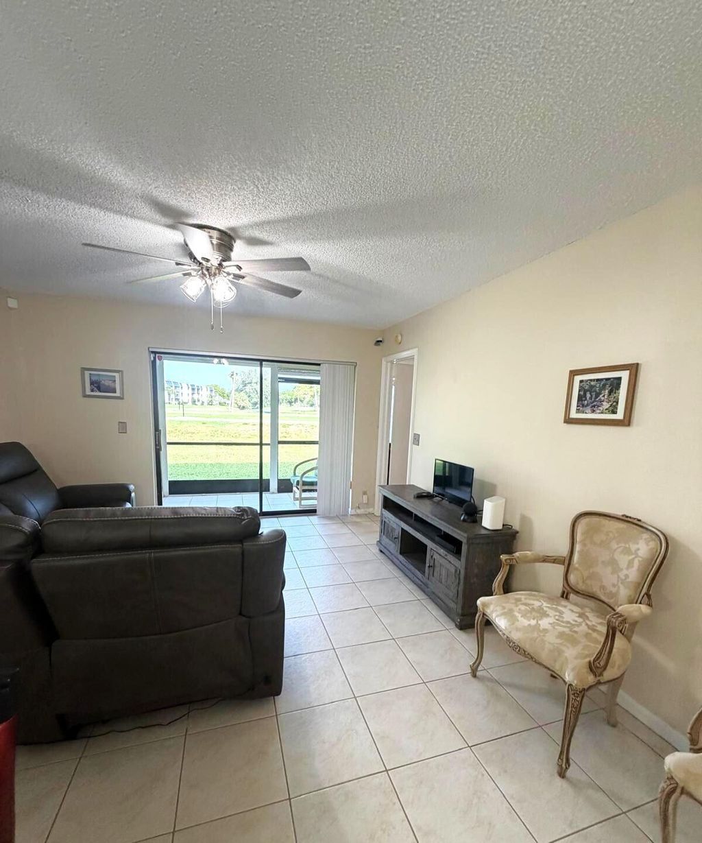 Photo of 4688 E Lucerne Lakes Blvd Boulevard E #104, Lake Worth, FL 33467 (MLS # B26029568)