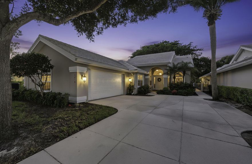 Lovely well maintained home in the heart of West Palm Beach! Enjoy South Florida living from the 24-hour manned golf gated community of Bear Island! This CBS residence features 3 bedrooms, 2 baths, side 2 car garage with large driveway, impact windows, newer A/C and tons of living space. Freshly painted with beautiful neutral tile flooring in main living areas and plush carpet in bedrooms, this home boasts tons of natural light, spacious kitchen with tons of cabinetry, Onyx counter tops and custom pantry and counter top in breakfast area - perfect for small workspace. Generous primary suite leads to master bath with separate tub and shower. Guests will enjoy 2 separate bedrooms and renovated guest bath. HUGE and private backyard is surrounded by lush landscaping -