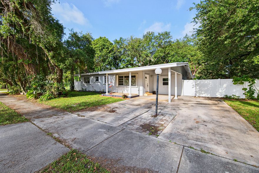 Nestled in the highly sought-after Shady Banks neighborhood, this charming 2 bed/2 bath home sits on an oversized corner lot with stunning wood beam vaulted ceilings and an open layout offering incredible flexibility. The spacious primary suite features a den area and oversized walk-in closet converted from a 3rd bedroom that could easily be restored. A bonus room with a private entrance, currently used as a laundry room, offers the opportunity for a 3rd bedroom, in-law suite, home office, or expanded living area. Hurricane protection includes accordion shutters and partial impact windows. Enjoy a covered carport & expansive driveway offering plenty of parking w/room for an RV/Trailer. Fully fenced with 6' PVC, the backyard features a large covered patio, mango tree and room for a pool. Shady Banks is a highly desirable, established neighborhood known for its tree-lined streets, community feel, Hortt Park, Bill Keith Nature Preserve and minutes to downtown Fort Lauderdale, Las Olas, I-95 and 595!