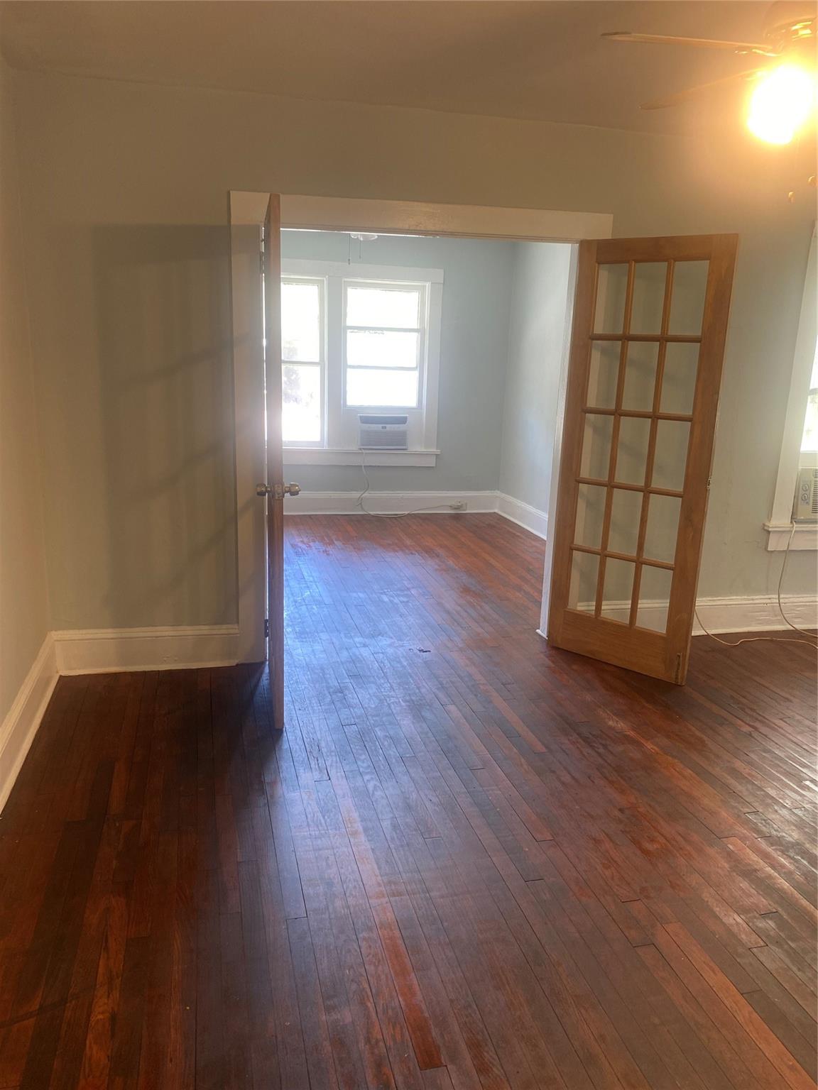 This charming one bedroom apartment in Hollywood, FL, offers a bright and airy living space with large windows and neutral tones throughout. The refinished floors provide a clean and low-maintenance surface, while the compact kitchen is equipped with essential appliances and ample storage. The bathroom features modern fixtures with a stylish round mirror and tiled walls for a fresh, updated feel. A ceiling fan and window AC unit ensure comfort year-round. Conveniently located near shops, dining, and major roads, this studio is perfect for those seeking an affordable, cozy living space in a prime location.