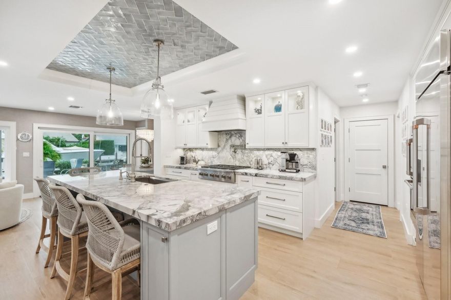 Welcome to your dream waterfront home in prestigious Lighthouse Point, Florida! This stunning 4-bedroom, 3-bath residence has been totally remodeled to perfection. Enjoy spectacular views with 85 ft of waterfront and a private dock. The outdoor area is an entertainer’s paradise, featuring a sparkling pool and spa, and a covered pavilion for shaded relaxation. Inside, the open-concept design showcases high-end finishes, appliances, and a walk-in chef's pantry, blending luxury and comfort. Adding to the allure is a full custom wet bar with ice maker and refrigerator, creating the perfect setting for luxury entertaining. With modern amenities, smart features, and proximity to fine dining and shopping, this home defines upscale coastal living. Don't miss this chance to own a piece of paradise!