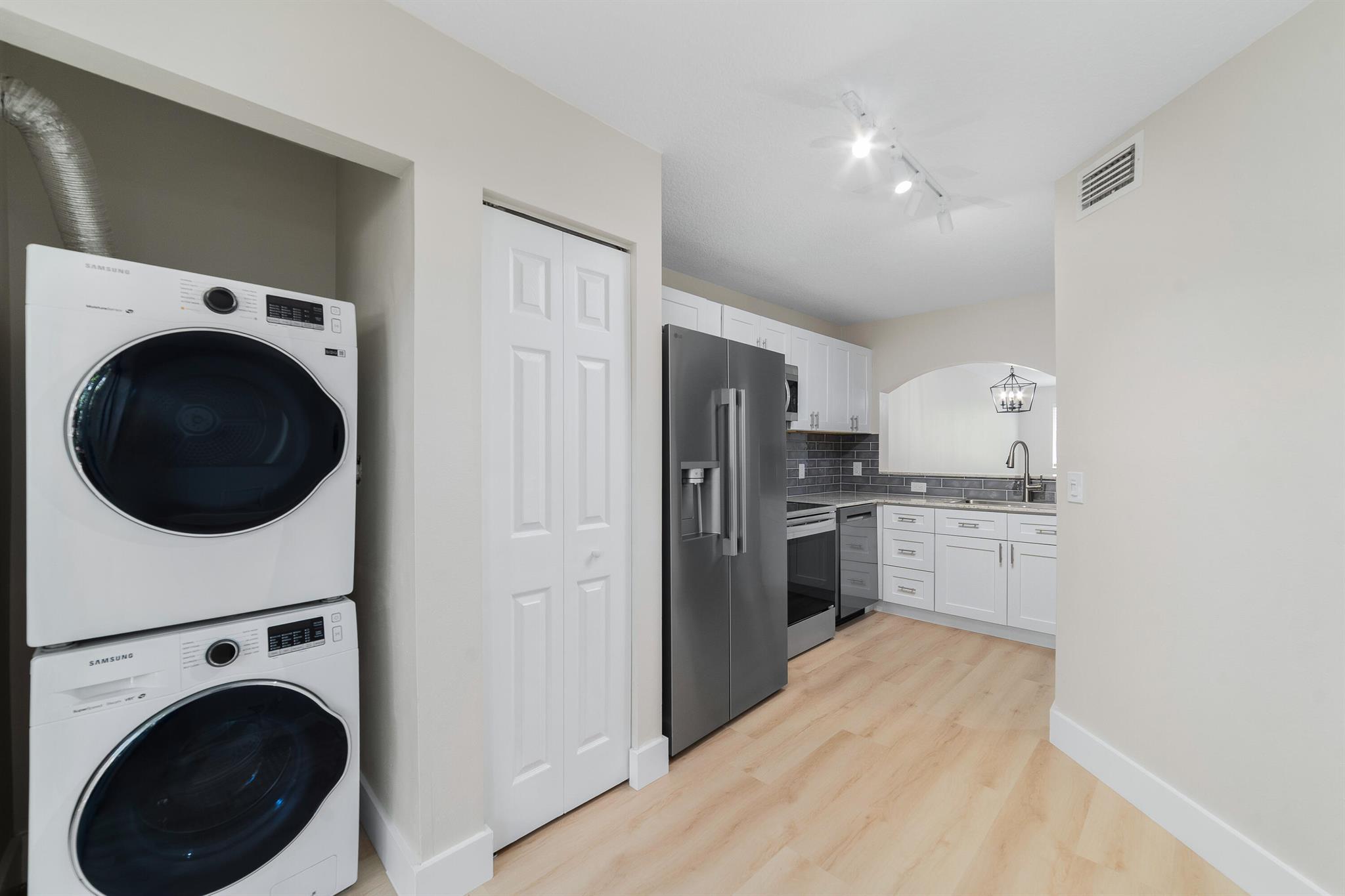 Be the First to Live in This Fully Renovated 2-Bed, 2-Bath Condo! A beautifully updated first-floor unit in the gated community of The Cove at Briar Bay. This move-in-ready condo features brand-new LG stainless steel appliances, white shaker cabinets with soft-close doors, a modern backsplash, and continuous luxury vinyl flooring built to withstand life's toughest spills. Both bedrooms offer spacious walk-in closets, and impact windows throughout the unit provide year-round security and energy efficiency. The community features a sparkling pool, perfect for relaxing or entertaining. Conveniently located just minutes from Downtown West Palm Beach, Palm Beach International Airport, and everything the Palm Beaches have to offer. Water is included in rent.