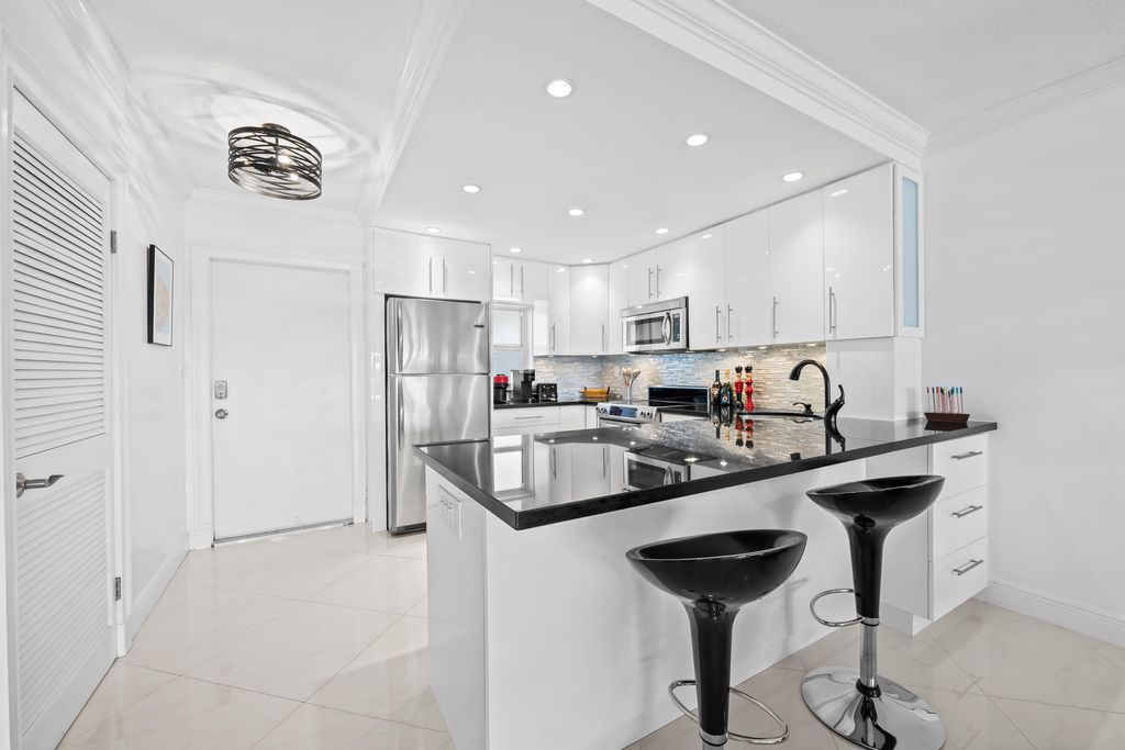 Photo of 400 N Federal Highway #315, Deerfield Beach, FL 33441 (MLS # B26013686)