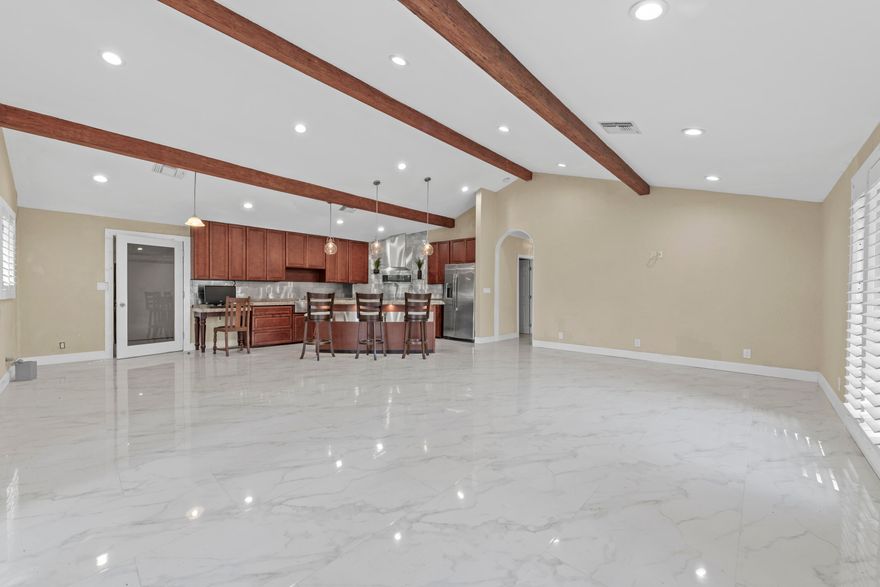 Welcome to this beautifully updated home located in the highly sought-after Shady Banks neighborhood of Fort Lauderdale, just minutes from Las Olas, downtown, I95, FLL airport, and the beach. This property perfectly combines classic South Florida charm with modern finishes. Property Highlights 3 Bedrooms | 2 Bathrooms Spacious open-concept living area with abundant natural light, plantation shutters, cathedral ceiling with oak beams. Modern kitchen featuring granite countertops, stainless steel appliances, and a large island. Primary suite with bath, Impact windows and doors for energy efficiency. NO HOA, Enjoy the tranquility of a quiet street lined with mature trees, walk to Hortt Park, playground, workout stations, tennis, volleyball, basketball, and ball field. "Hidden gem"neighborhood