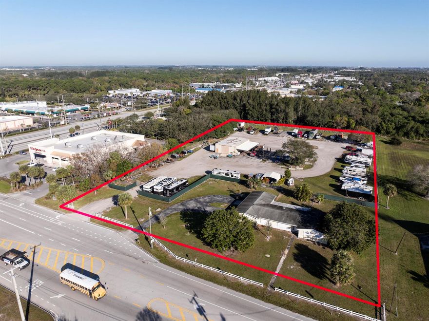 Prime commercial property just off US #1.  Located between Port St Lucie and Fort Pierce in very desirable White City.The property adjoins a 4.75 undeveloped property fronting US #1.  Combining the 2 sites total 9 acres with frontage on US #1 and Midway Rd.This property has 315 feet on Midway Rd and is the 2nd parcel east of US #1.  The property is currently developed with a 3,000 sq ft metal shop building with 14' x 14' door + 2 large airplane hangar style doors, built 1983 with water & electric to the building  and a CBS home with over 3,800 total sq feet(3 brs, 2.5 baths with a 2.5 car garage).  Both buildings are on well & septic, however a 12 inch water main is in front of the property(see map in documents tab). Each building is on a separate electric meter.