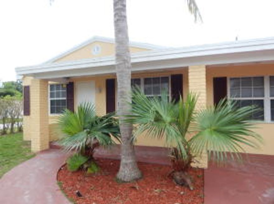 Charming 3 bedroom, 2 bath home only blocks from the Intra-costal! Bring your fishing poles. Updated kitchen features new granite countertops and stainless steel appliances. New vanities and fixtures in bathrooms. Tile flooring throughout home. Updated electrical. This house has that old Florida charm!Don't miss out!