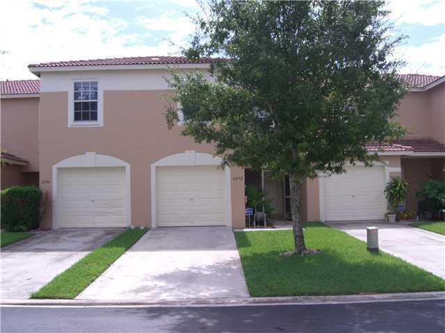 Nicely maintained townhome with a one car garage in the gated Rivermill community of Lake Worth. Spacious 3 bedroom, two and a half bath with screened in lanai and private backyard. Community pool. Close to shopping/dining and minutes to I95 and Turnpike.
