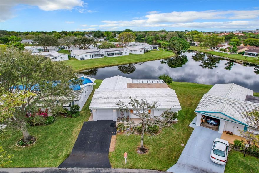 ***DIRECTLY ON THE WATER***EXTRA LARGE EXTENDED LAKEVIEW MODEL***BONUS ROOM***LARGE SCREENED PATIO OVERLOOKING LAKE***QUIET STREET W/PEACEFUL AMBIANCE***2 BEDROOM/2 BATH, 1 CAR GARAGE W/DOUBLE WIDE DRIVEWAY***FRONT PORCH**SPLIT BEDROOM FLOOR PLAN***UPDATED KITCHEN W/STAINLESS STEEL APPLIANCES & GRANITE COUNTER TOPS***FOOD PANTRY W/CUSTOM CABINETS & EXTRA STORAGE SPACE***TILE & LAMINATE FLOORING**CROWN MOLDINGS***HURRICANE & ROLLUP STORM SHUTTERS IN BONUS ROOM**NEW ROOF 2023***NEWER A/C 2015***PROPERTY WON’T LAST LONG***55+ COMMUNITY, 20% DOWN, 720 CREDIT SCORE***ASSOC. FEE INCL: FIBER OPTIC HD TV & INTERNET, COURTESY BUS, LAWN SERVICE, ROOFS, EXTERIOR PAINTING, CLUBHOUSE, 2 POOLS, TENNIS, POOL TABLES, PING PONG, CARD ROOMS, SHOWS, FITNESS CENTER & MUCH MUCH MORE(Phase 4) **DIRECTLY ON THE WATER** EXTRA LARGE EXTENDED LAKEVIEW MODEL**BONUS ROOM** LARGE SCREENED PATIO OVERLOOKING LAKE**QUIET STREET W/PEACEFUL AMBIANCE**2 BEDROOM/2 BATH, 1 CAR GARAGE W/DOUBLE WIDE DRIVEWAY**FRONT PORCH**SPLIT BEDROOM FLOOR PLAN** UPDATED KITCHEN W/STAINLESS STEEL APPLIANCES & GRANITE COUNTER TOPS**FOOD PANTRY W/CUSTOM CABINETS & EXTRA STORAGE SPACE**TILE & LAMINATE FLOORING**CROWN MOLDINGS**HURRICANE & ROLLUP STORM SHUTTERS IN BONUS ROOM**NEW ROOF 2023**NEWER A/C 2015**PROPERTY WON’T LAST LONG**55+ COMMUNITY, 20% DOWN, 720 CREDIT SCORE**ASSOC. FEE INCL: FIBER OPTIC HD TV & INTERNET, COURTESY BUS, LAWN SERVICE, ROOFS, EXTERIOR PAINTING, CLUBHOUSE, 2 POOLS, TENNIS, POOL TABLES, PING PONG, CARD ROOMS, SHOWS, FITNESS CENTER & MUCH MUCH MORE(Phase 4) (****Occupancy MAY 1 ST 2024****)