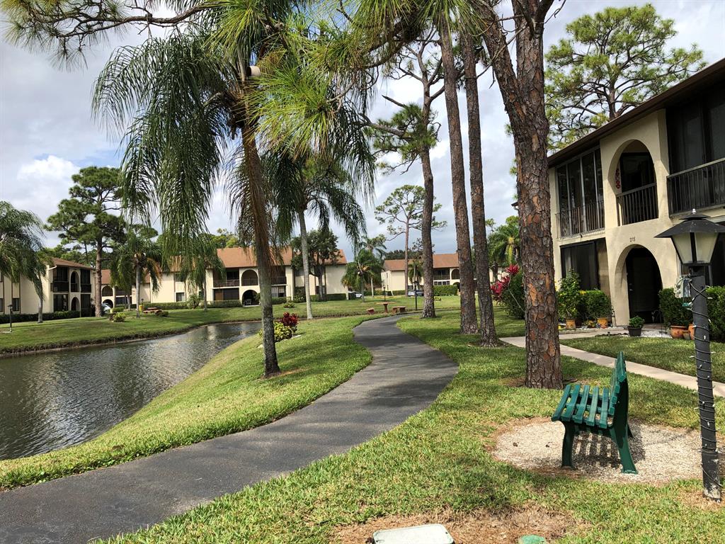 At over 1100sf, this beautifully furnished condo is one of the largest 2 bedroom units in the coveted Pine Ridge South development! Pine Ridge is a 55+ community, which allows additional residents between 25+ years. Interior is tastefully furnished and walls recently repainted. Grounds are immaculately maintained. 1st floor condo allows for easy accessibility. Living room and lanai face a serene lake view. Bike trail just outside your front door. Social activities and clubs such as, pickleball, golf club, bocce ball, shuffleboard, bingo, and more is available. Some utilities included. This one won't last!!