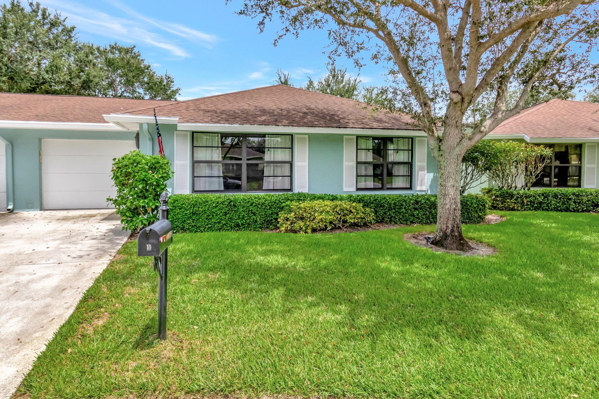 Lovely and bright 2/2 villa with a canal view, close to shopping and the beach! Features an updated kitchen with solid wood cabinets and ceramic tile throughout. The spacious master bedroom includes a custom Elfa system. Enjoy the beautiful canal view from your enclosed or outdoor patio, with the enclosed patio offering roll-down shutters for privacy. Recent upgrades include impact windows, a new A/C (2022), and an updated electric panel (2022). Association fees cover water, cable, lawn care, and exterior maintenance. The active community offers a pool, bocce court, and billiards.