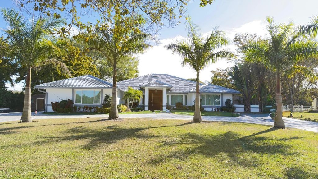 Photo of 5928 NW 77th Terrace, Parkland, FL 33067 (MLS # F10550064)