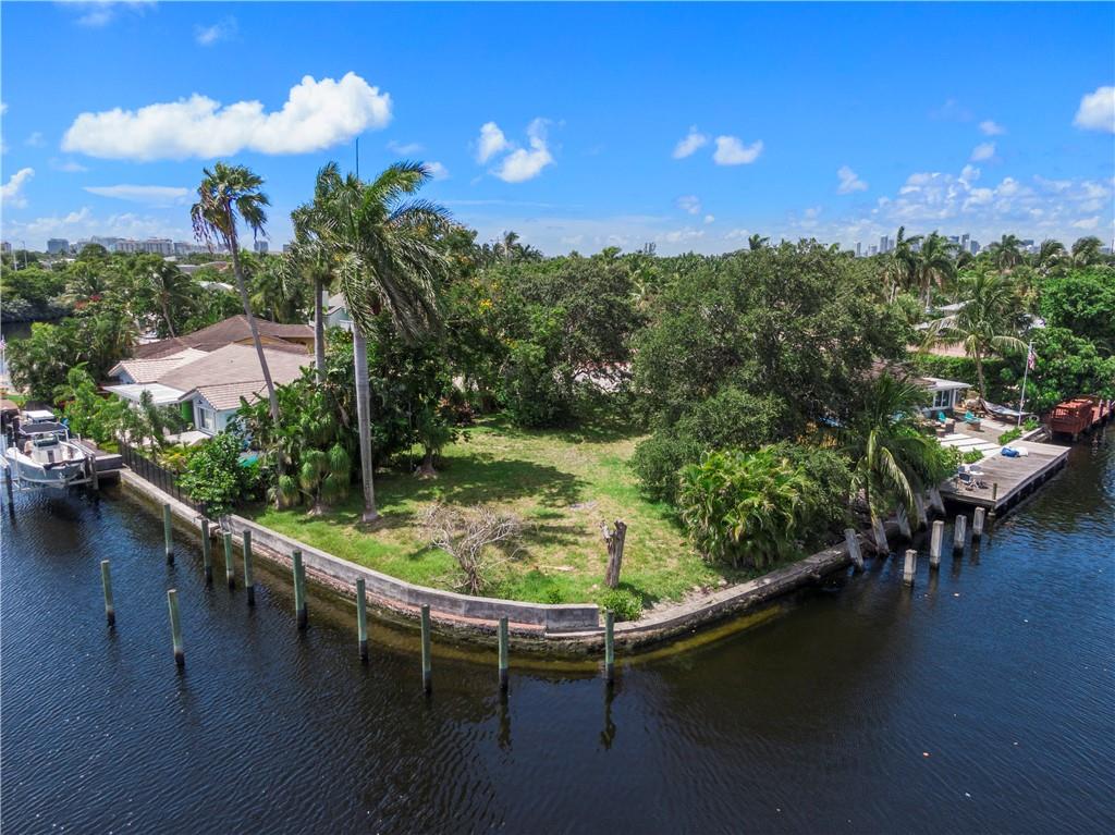 Rare Waterfront Point in East Wilton Manors awaits your Signature New Home! Over 130FT water frontage wraps around this prime point at the intersection of a wide canal & Lake Elizabeth. Large turning basin for watercraft. Just two fixed bridges to the Intracoastal with 10+FT clearances. Wide water views all around from this end of Cul-De-Sac location. The very private E Wilton Manors island neighborhood of luxury homes surrounds this rare parcel. Bring your builder. Bring your Donzi or other boat. No HOA! Prime waterfront points like this one do not come along every day. Near Wilton Drive entertainment, restaurants. Whole Foods, Trader Joes, and high-end shopping practically around the corner. A video waterway tour streams at the Coldwell Banker website and other sites.