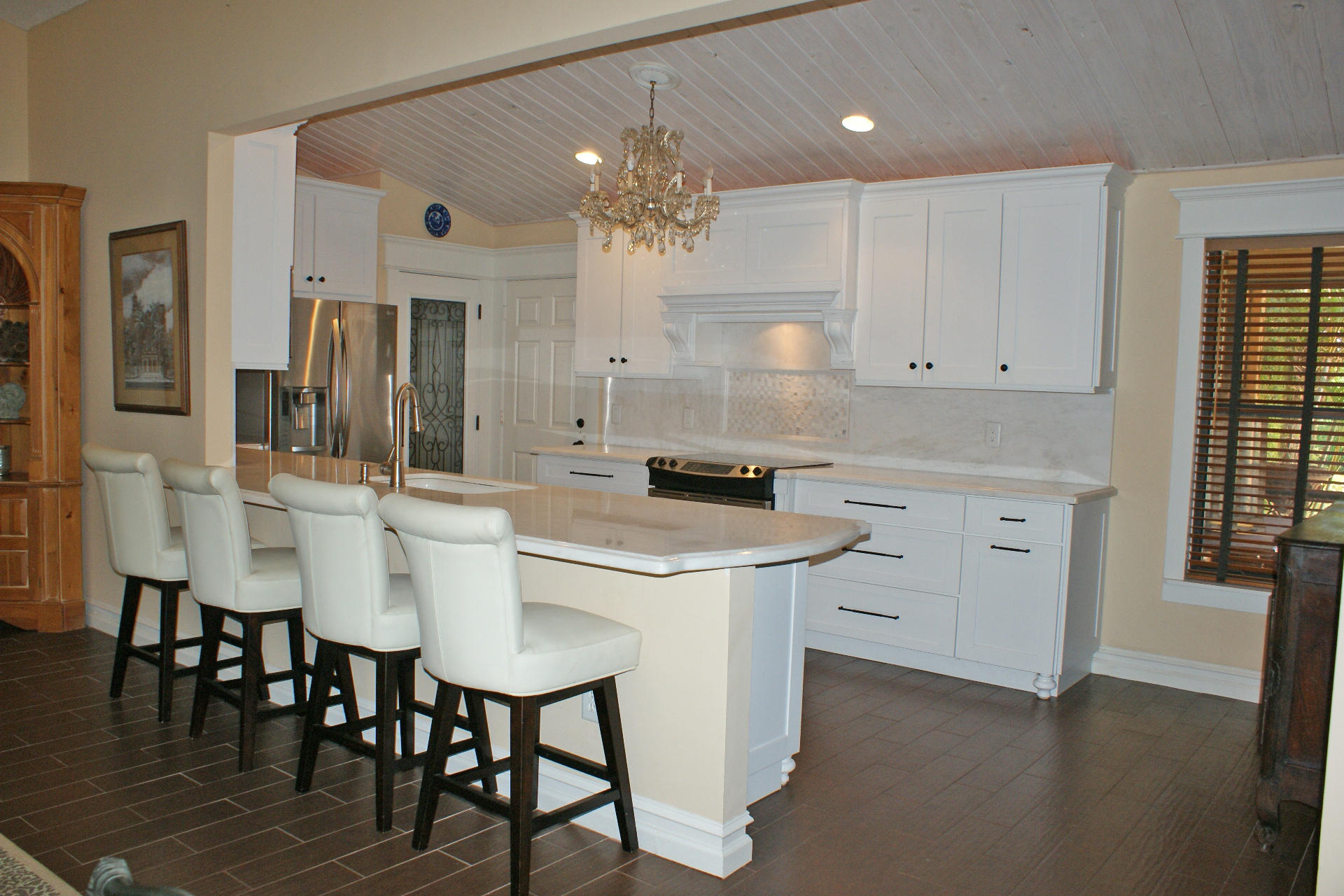 Don't miss this one!! Beautifully remodeled decorators former home. Kitchen, bathrooms and entire home remodeled with high end finishes...absolutely immaculate. Enjoy a large screened patio and private fenced yard with a gate that when opened will allow to make the short walk to the community pool...like having one right in your backyard! Great Wellington location, close to everything Palm Beach County has to offer.