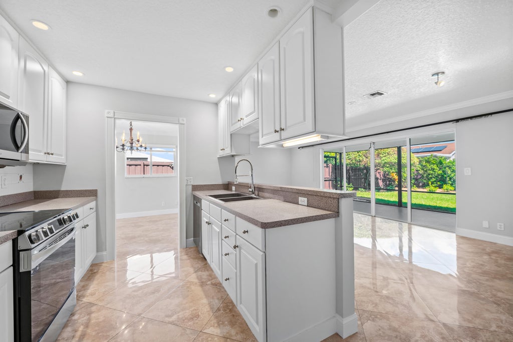Photo of 3291 NW 63RD Street, Fort Lauderdale, FL 33309 (MLS # B26069777)