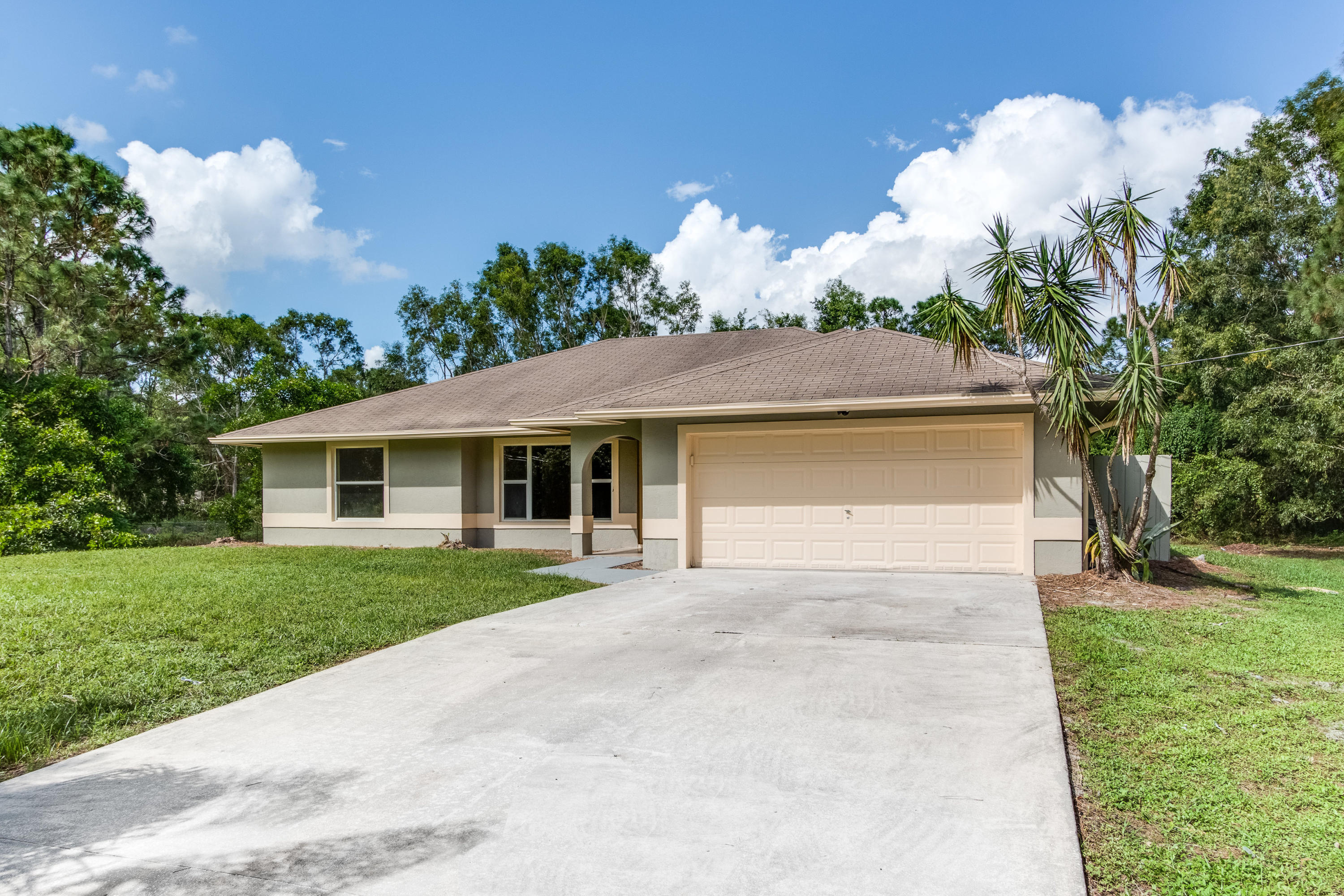 Completely updated 3 bedroom, 2 bath, 2 car garage CBS home on a fully fenced 1.32 acre lot in the acreage. This house has been fully renovated and features a brand new kitchen with solid wood cabinets, granite countertops, and stainless steel appliances. All brand new flooring throughout with wood in the living areas, tile in the kitchen and baths, and carpet in the bedrooms. Large screened in patio and storage shed in the back yard. New fixtures and fans throughout. This property shows great and will not last long!