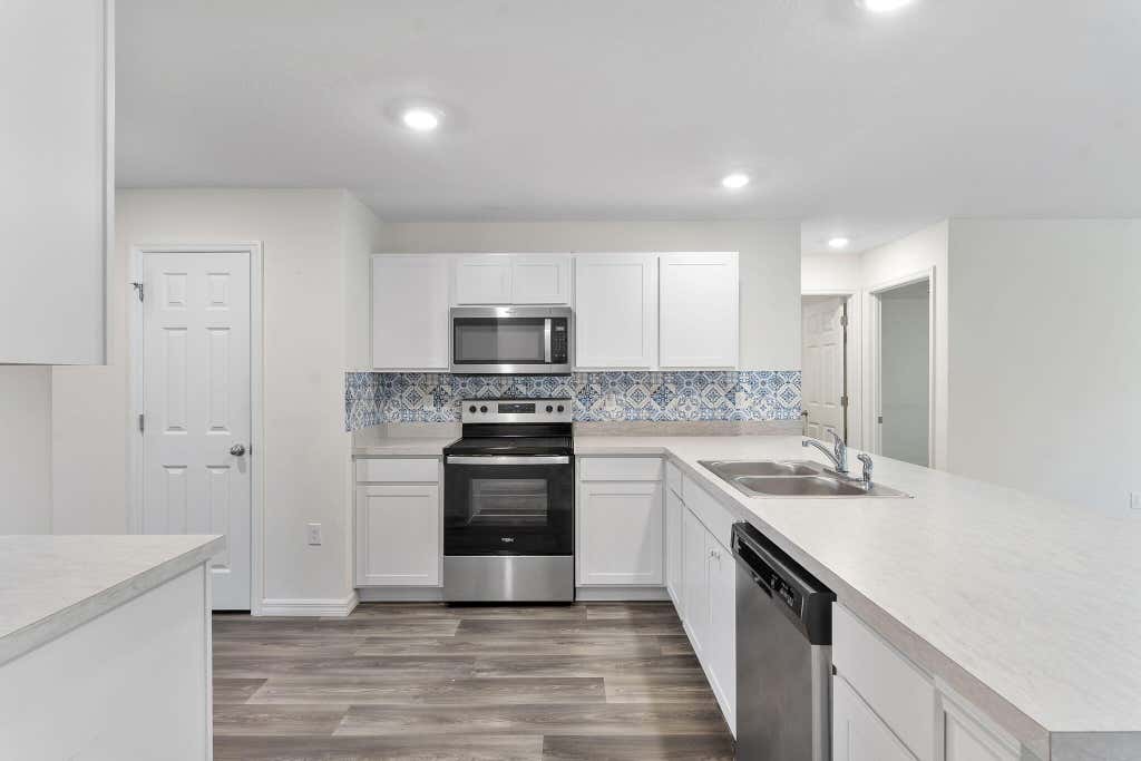 Photo of 619 SW Hamberland Avenue, Port Saint Lucie, FL 34953 (MLS # B26063962)