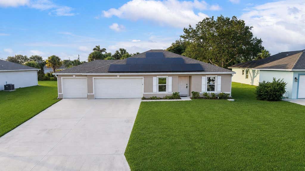 Photo of 619 SW Hamberland Avenue, Port Saint Lucie, FL 34953 (MLS # B26063962)