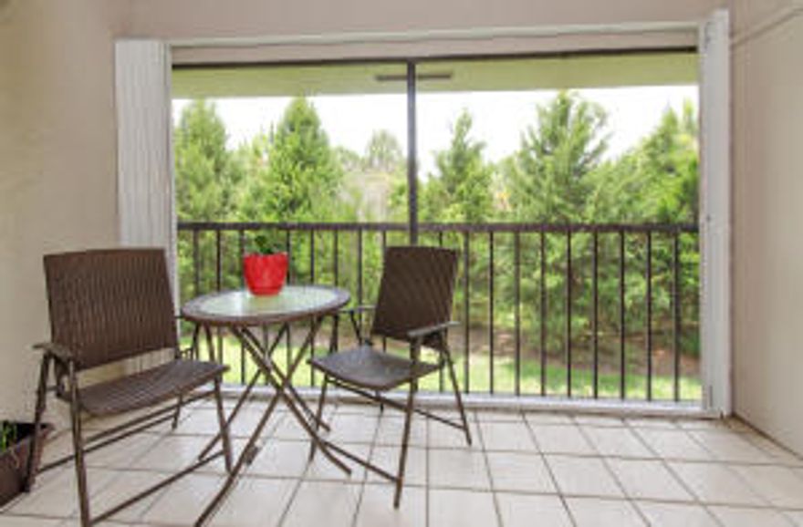 Heart of Palm Beach Gardens. 2 bed, 2 bath condo with relaxing woods view from the front door through the living room to balcony. Laminate floor, tile in kitchen and screened in patio, carpet in bedrooms. Huge walk in closet with custom built-ins. Lots of storage. Custom hurricane shutters.  Over-sized updated/upgraded shower in master bath and updated vanity in second bath. Newer full-size washer/dryer. Water and cable included in low HOA. Roofs replaced in 2011. Community pool, free wifi in clubhouse. One pet under 50 lbs. Close to I-95 and Florida's Turnpike, restaurants, shopping and beautiful beaches. Move in ready!