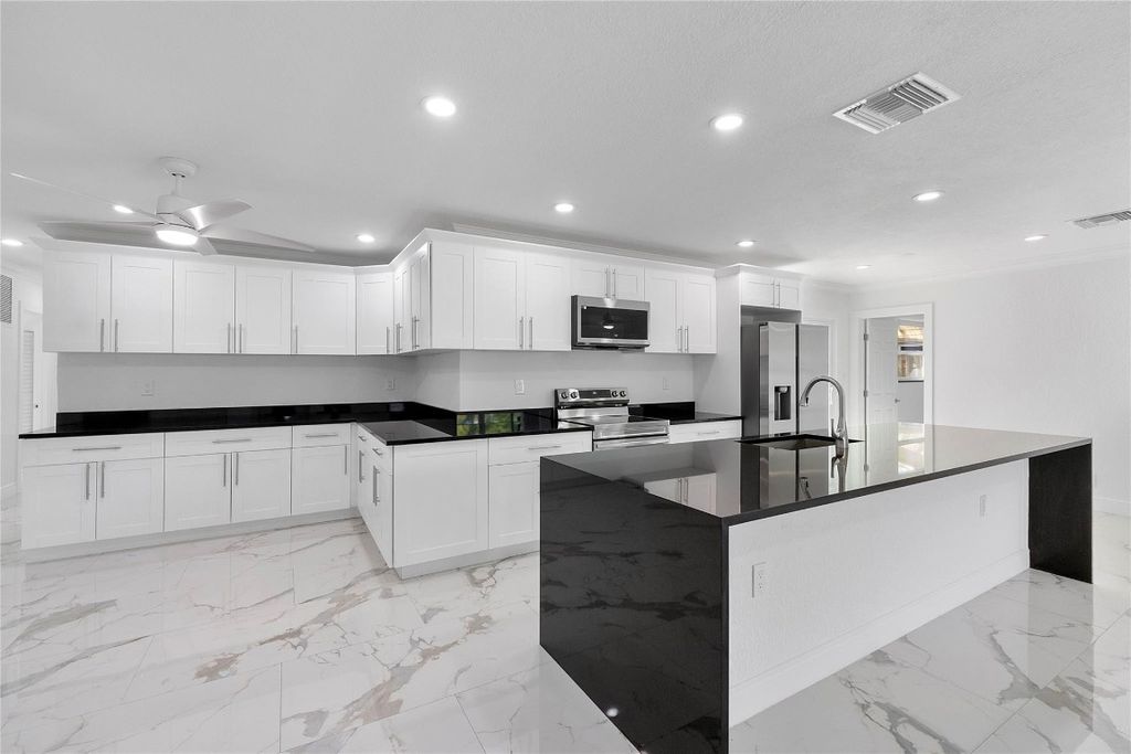Photo of 1411 NW 54th Terrace, Lauderhill, FL 33313 (MLS # F10548990)
