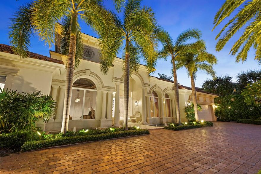 Desirable South Facing lot!! 100 feet of water frontage  on Wide Canal. Live in one of the most exclusive neighborhoods as recognized by Forbes - Royal Palm Yacht & Country Club. This is an amazing opportunity to own a traditional waterfront residence that features luxurious detailing throughout. With 3 bedrooms, 3 1/2  bathrooms, a custom office and bar, a personal library, this superior residence exemplifies the very essence of Florida's opulent lifestyle. The finest of materials, craftsmanship and architectural splendor are evident throughout the residence. From the custom-built mahogany bar to the European-styled baths, this estate home appeals to those with elegant tastes. Soaring, high ceilings create a light and bright ambiance throughout.