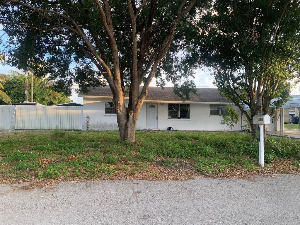 Photo of 9220 Artist Place, Lake Worth Beach, FL 33467 (MLS # R10883367)