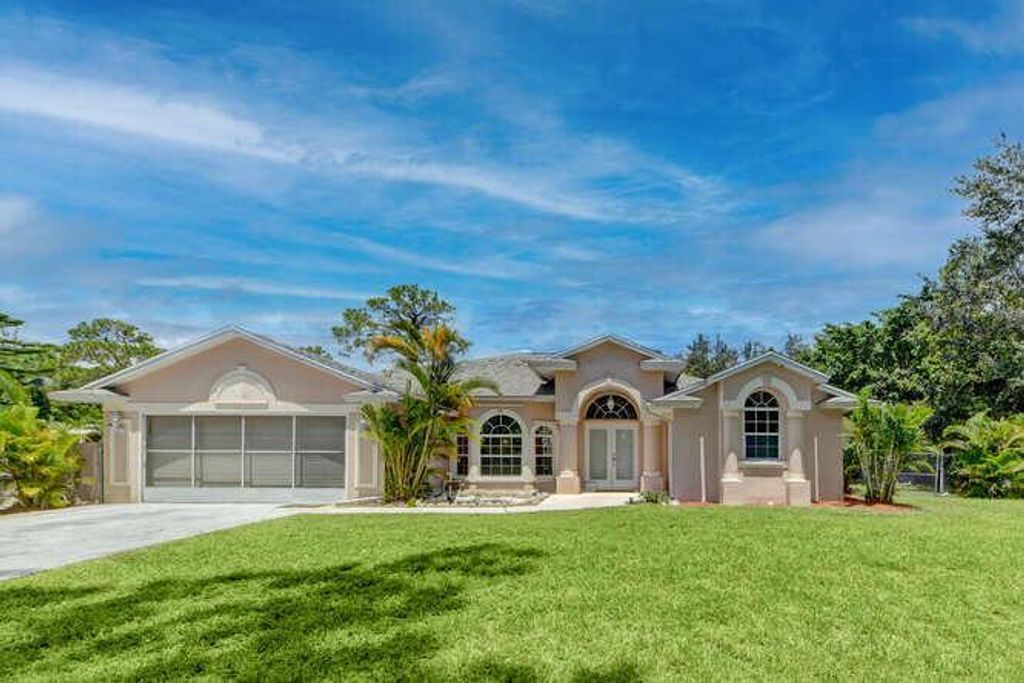 Photo of 5923 SE Orange Blossom Trail, Hobe Sound, FL 33455 (MLS # R10739056)