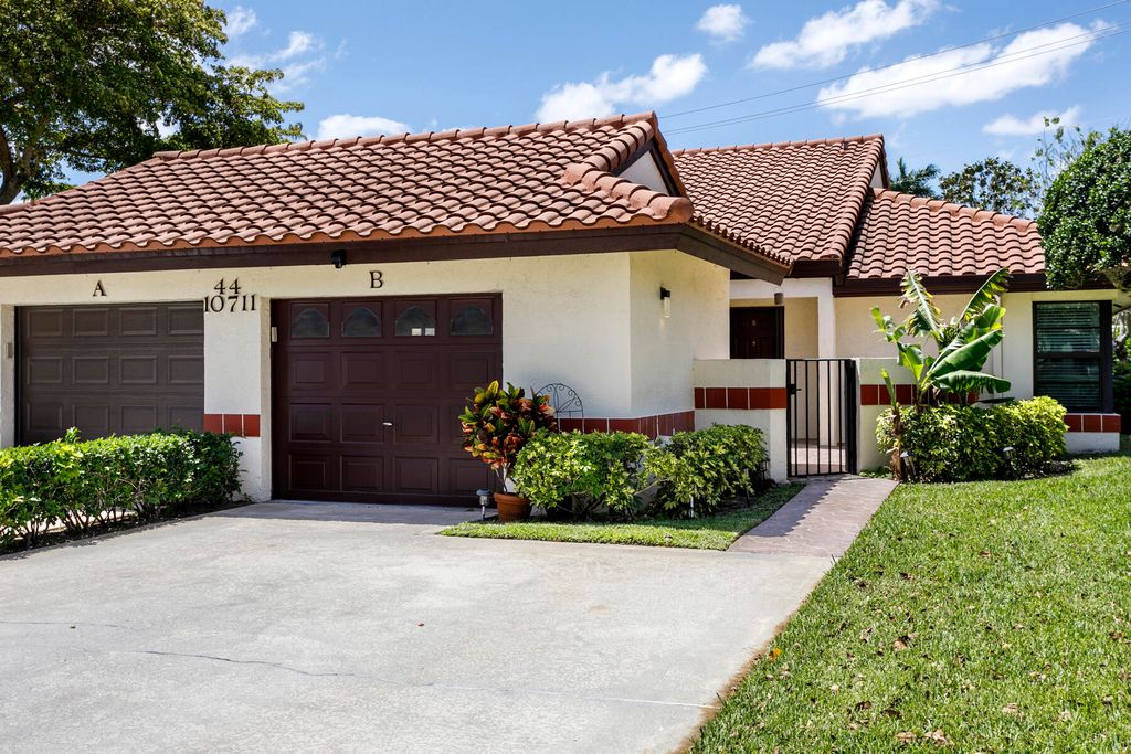 Photo of 10711 Palm Leaf Drive #B, Boynton Beach, FL 33437 (MLS # B26014935)