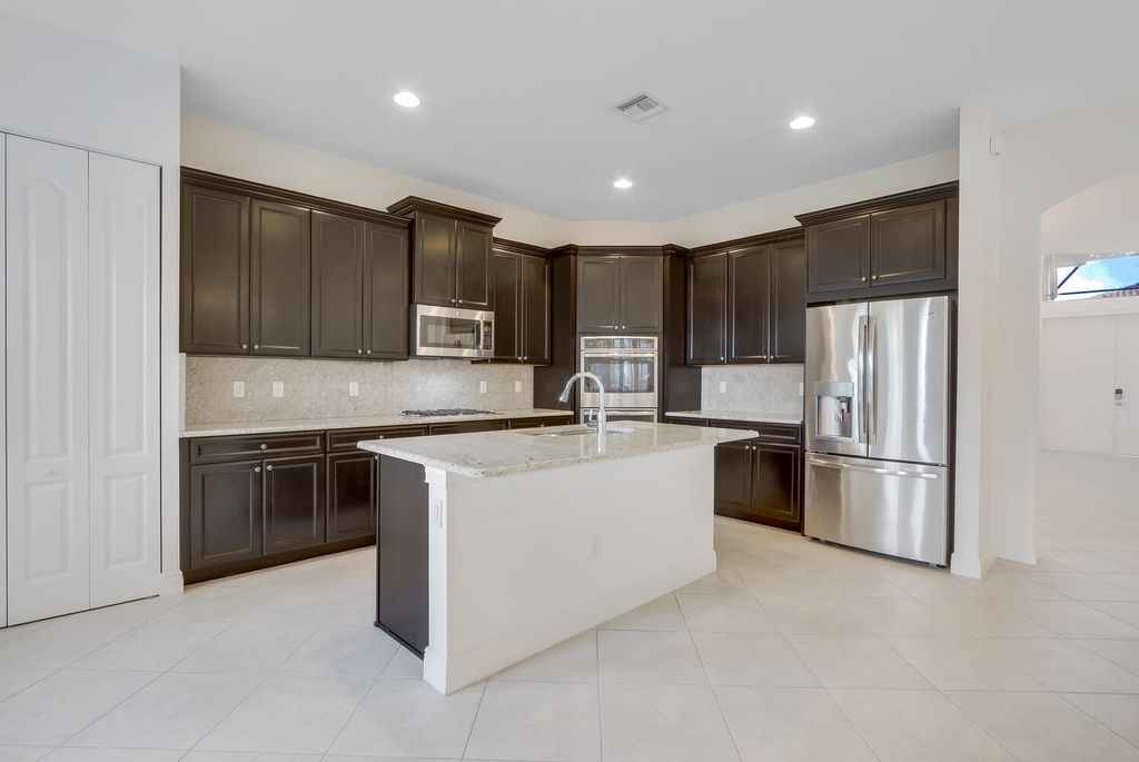 Photo of 9761 S Miralago Way, Parkland, FL 33076 (MLS # B26007585)