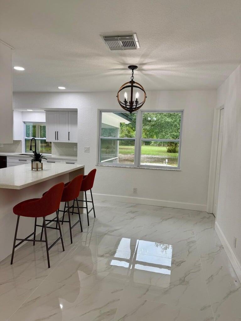 Photo of 2812 F Road, Loxahatchee Groves, FL 33470 (MLS # B26044737)