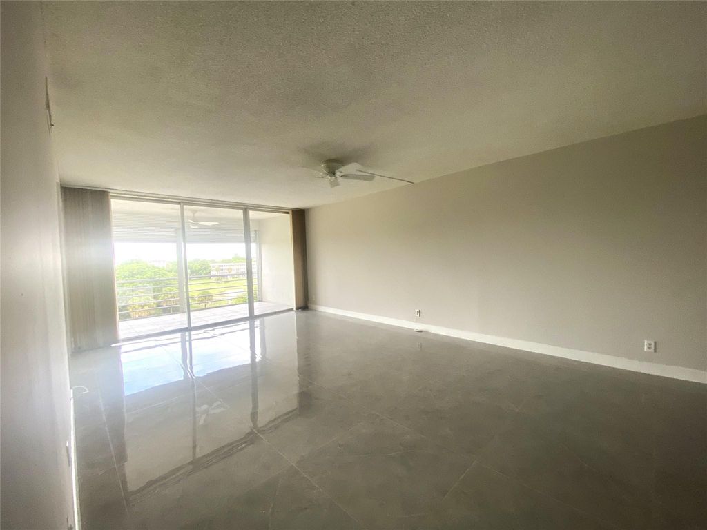 Photo of 2671 S Course Drive #602, Pompano Beach, FL 33069 (MLS # B26038784)